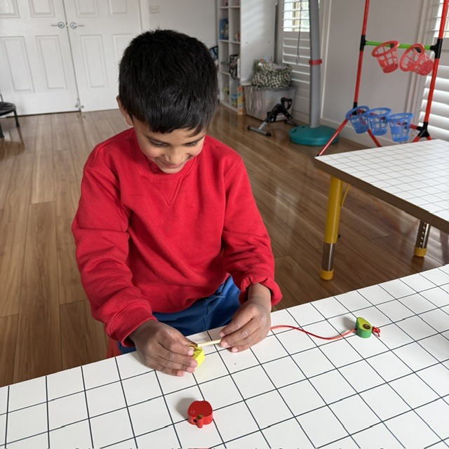 Bimanual Bead Threading